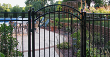 Sanibel Black Metal Pool Fence Panels and Gate With Flattened Finials